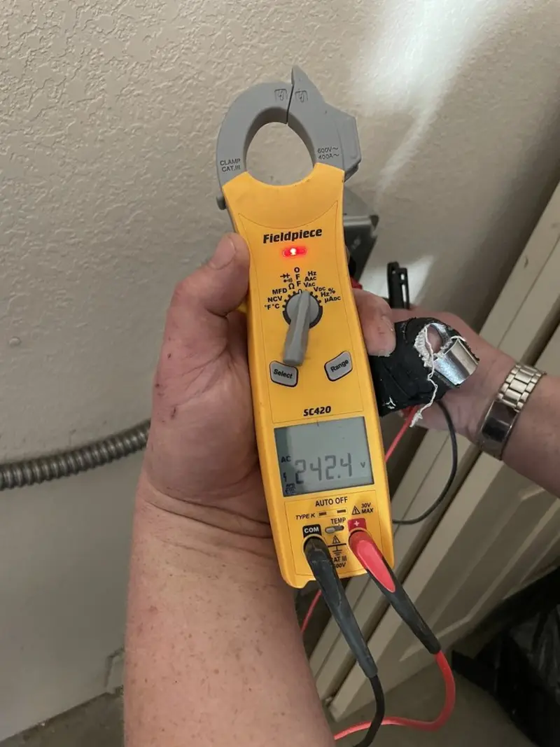 Voltage testing with clamp meter during Whole House Surge Protector in Pleasant Grove